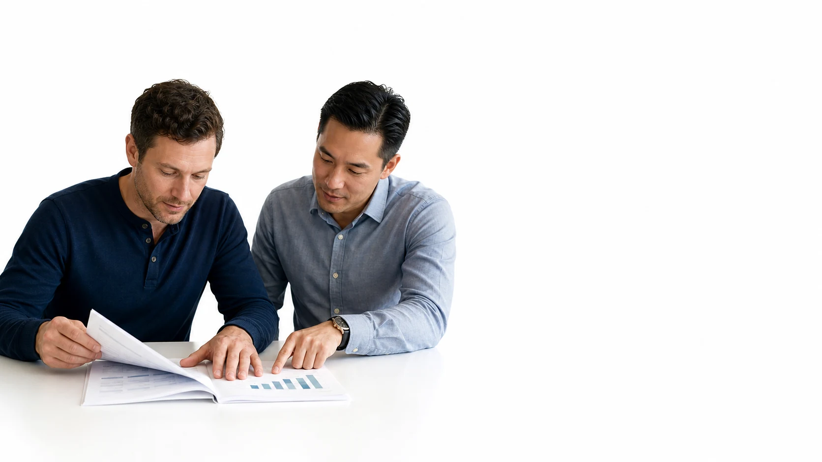 A business owner and trusted professional review one financial record together.